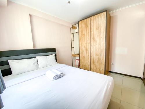 Cimahi Apartment | Minimalist 2BR with Pool View at Gateway Pasteur Apartment By Travelio