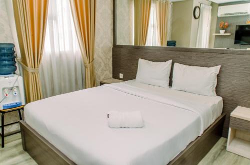 Pondok Aren Apartment | Minimalist and Comfy Studio at Bintaro Icon Apartment By Travelio