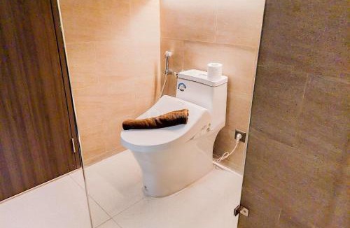 Pagedangan Apartment | Best Deal and Homey 1BR Apartment Carstensz Residence By Travelio