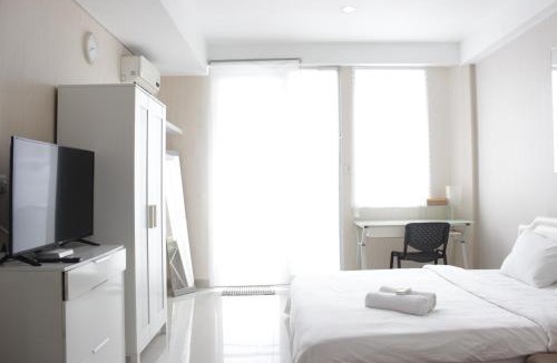 Hegarmanah Apartment | Bright Studio Room at Dago Suites Apartment near ITB By Travelio