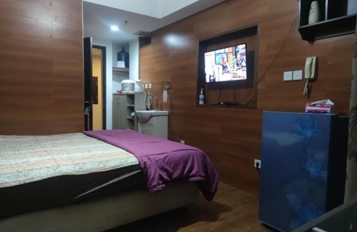 Bekasi Timur Apartment | Grand Dhika Apartement by 2325 Studio room with cozy wooden style room