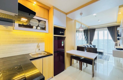 Mlati Apartment | Neat Warm Wooden Tone 1Br At Patraland Amarta Apartment