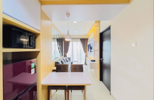 Mlati Apartment | Neat Warm Wooden Tone 1Br At Patraland Amarta Apartment