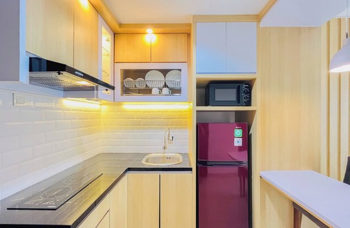 Mlati Apartment | Neat Warm Wooden Tone 1Br At Patraland Amarta Apartment