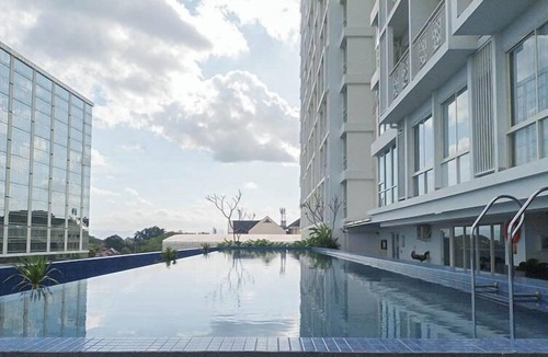 Mlati Apartment | Neat Warm Wooden Tone 1Br At Patraland Amarta Apartment