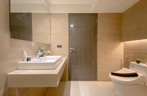 Pagedangan Apartment | Studio Apartment with Sofa at Carstensz Residence By Travelio