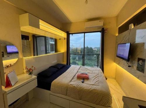 Apartemen Grand Kamala Lagoon by Cozy Room