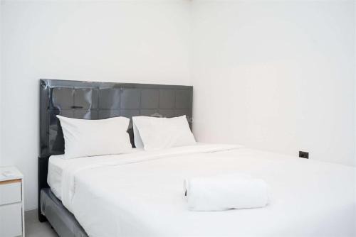 Enjoy Living 2BR Apartment at Carstensz Residence By Travelio