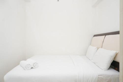 Spacious 2BR Green Bay Pluit Apartment By Travelio