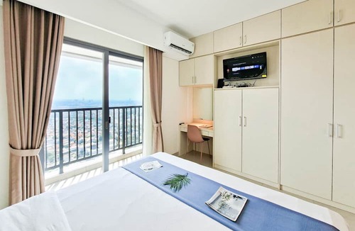 Pondok Aren Apartment | Wooden Accents 1Br Without Living Room At Bintaro Embarcadero Apartment