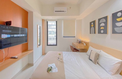 Depok Apartment | Cozy Living Studio at Evenciio Margonda Apartment