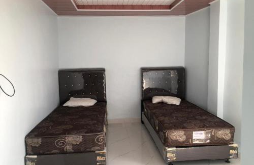 Deli Serdang Hotel | OYO 95450 Raja Coffe