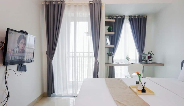 Minimalist And Restful Studio Room At Apartment Grand Dhika City
