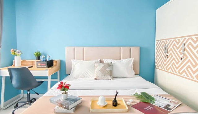 Neat Studio With Blue Toned Wall At Dramaga Tower Apartment