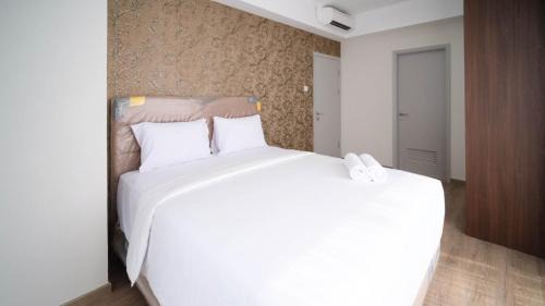 3BR with Private Lift Connected to Mall Grand Sungkono Lagoon Apartment By Travelio in Surabaya